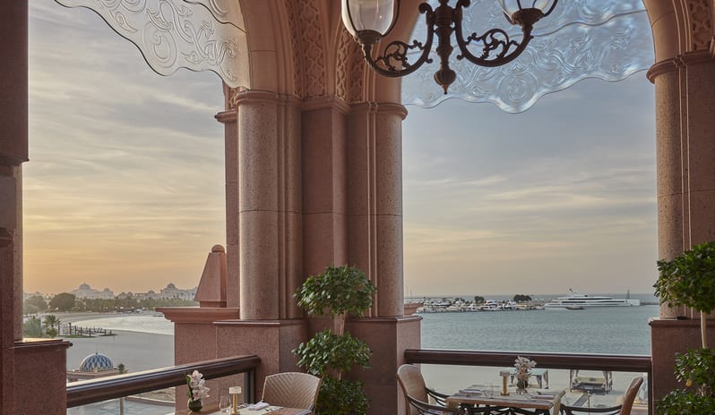 Emirates Palace Mandarin Oriental - Le Vendome outdoor terrace with view of beach (sunset)